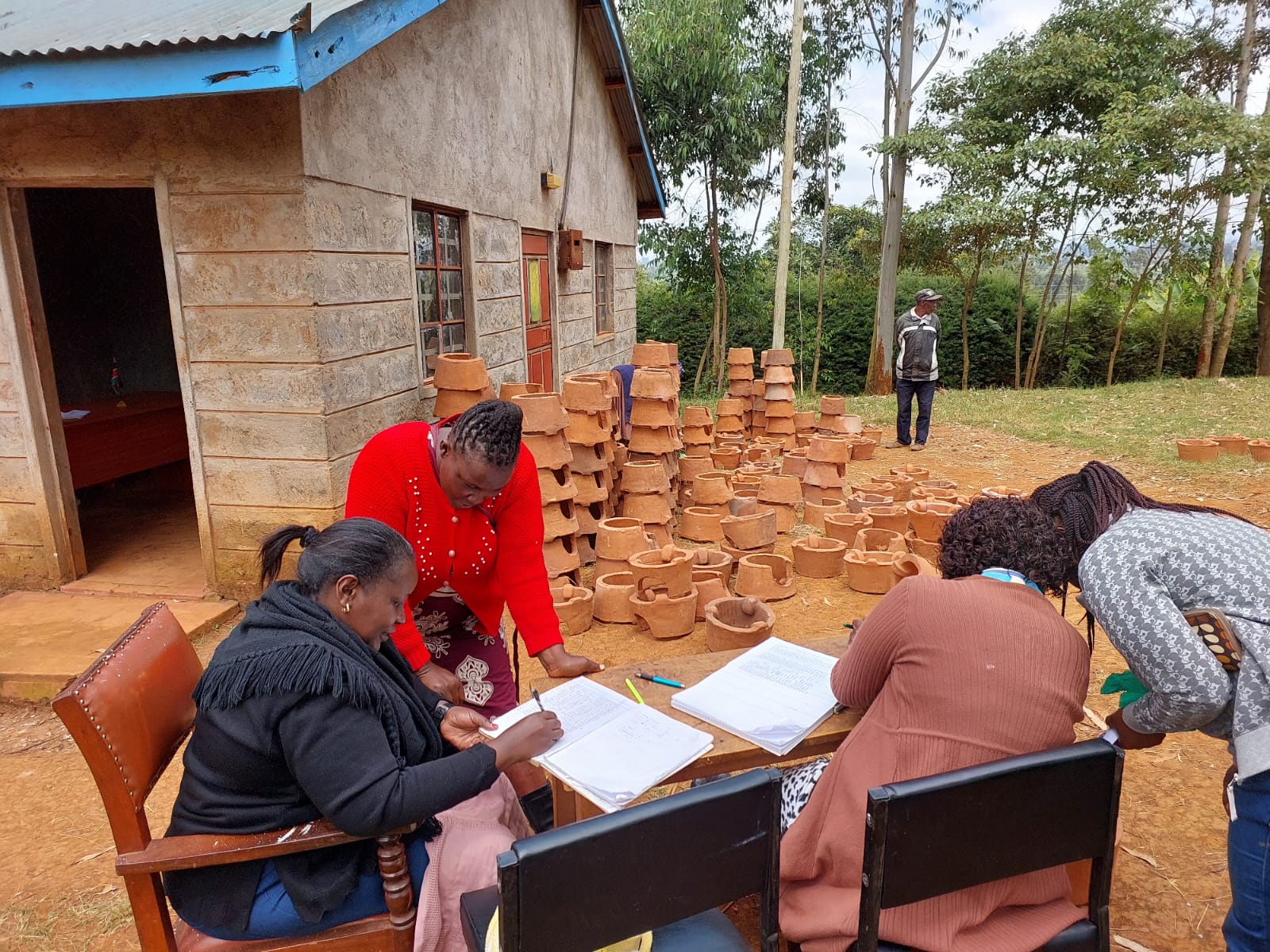 Community members receiving Jiko Kisasa cookstoves